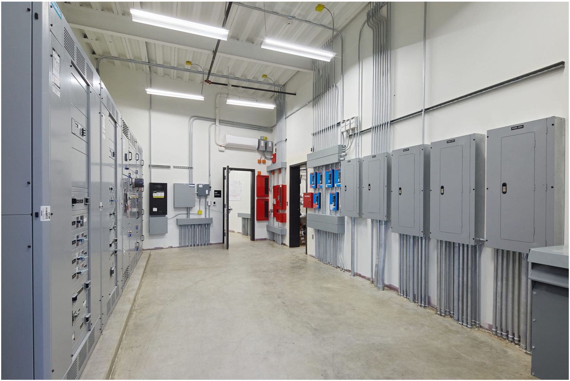 A row of electrical panels in a commercial setting to illustrate Commercial Maintenance and Troubleshooting