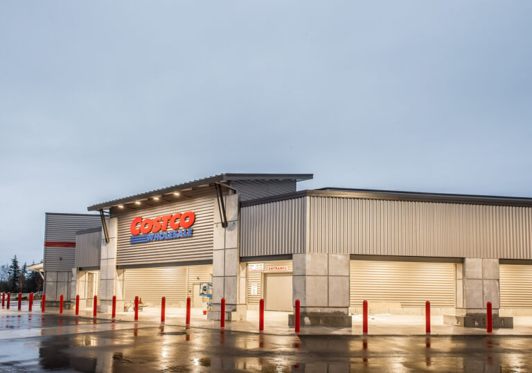 Exterior view of a Costco Warehouse in Bellingham, WA, highlighting its metallic facade and prominent Costco logo. For electrical services in Vancouver, WA, contact our reliable electricians.