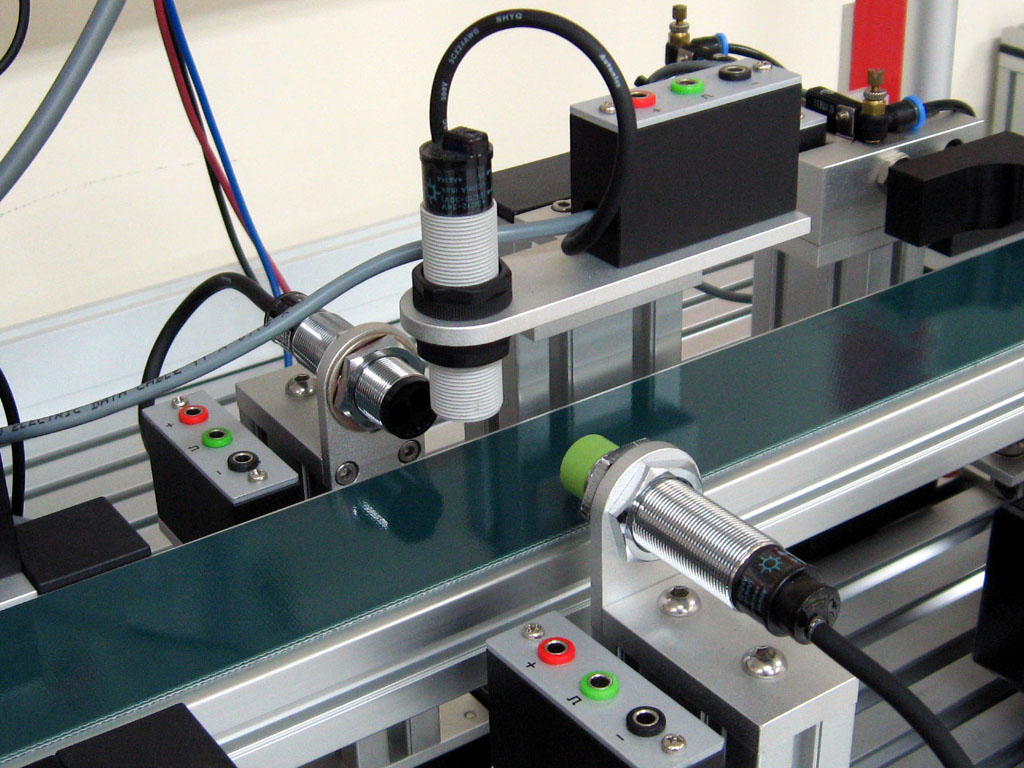 Detailed view of conveyor controls, sensors, and switches installed by electricians in Vancouver, WA.