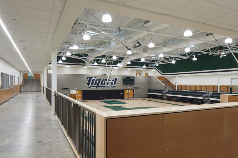 An overhead view of the Tigard High School indoor basketball court highlights the need for reliable electrical services. Expert electricians in Vancouver, WA can ensure optimal lighting installation and maintenance for such sports facilities, enhancing safety and performance.