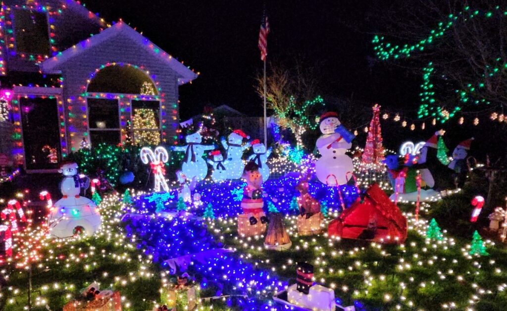 Vancouver, WA front yard lit with professional Christmas lights and figures installed by local electricians for the 2025 season.