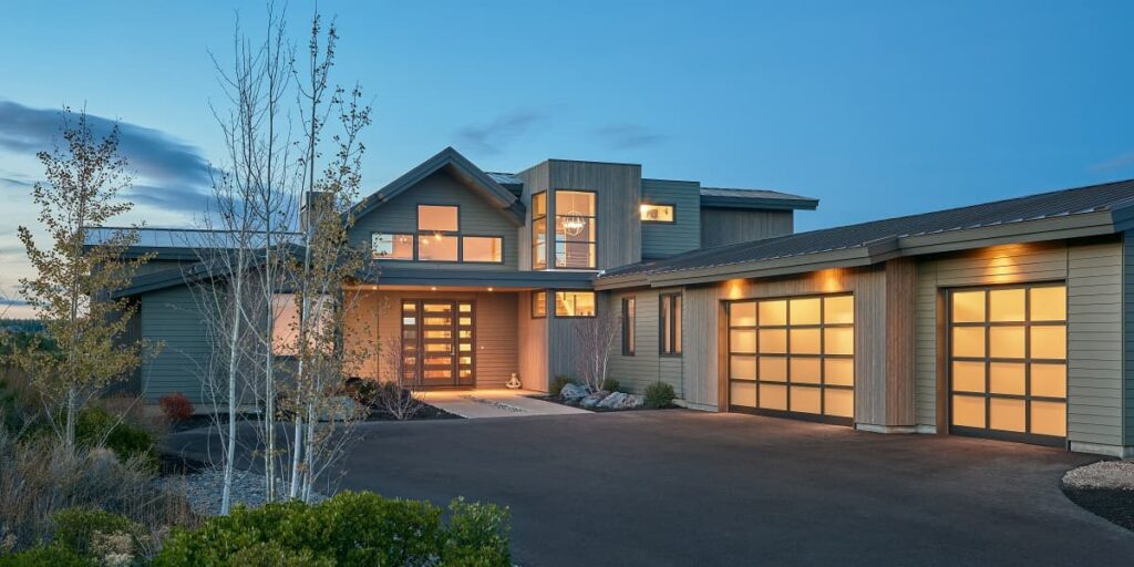 The exterior of a modern home in Vancouver, WA at dusk, showcasing the beautiful residential electrical work done by our local electricians.