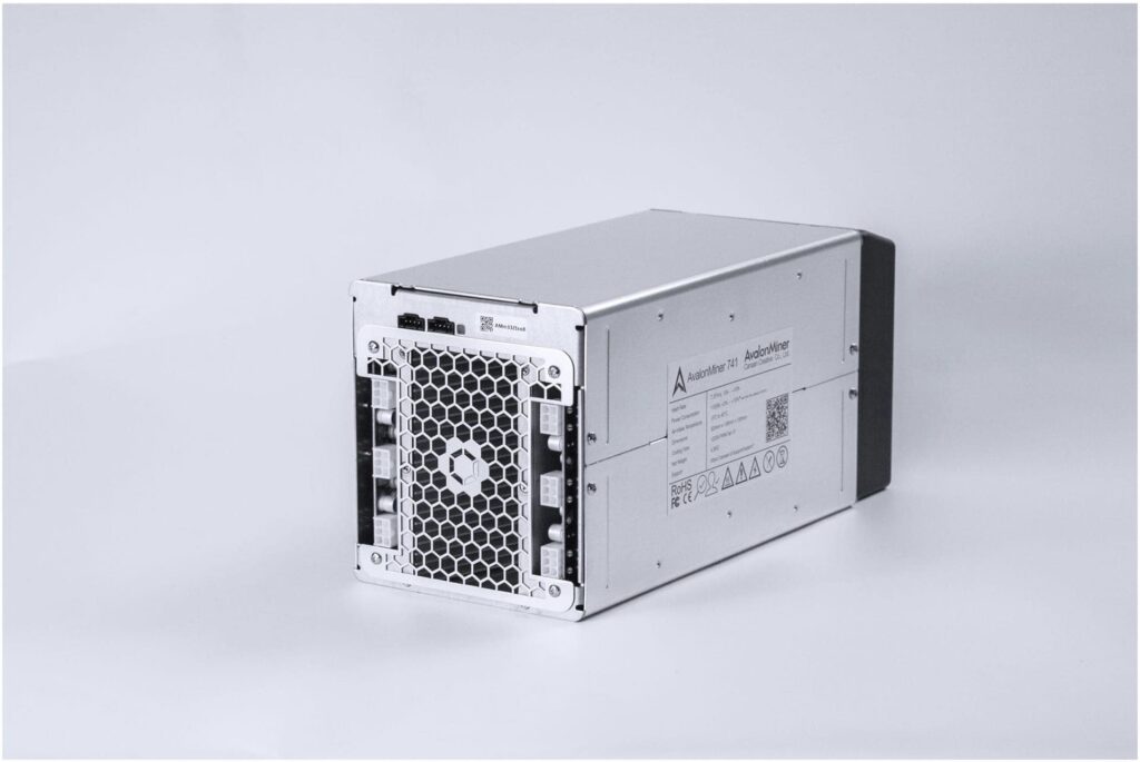 A silver electronic device with a honeycomb-patterned ventilation panel on one end and visible ports for connectivity, offering expert craftsmanship reminiscent of a skilled Vancouver electrician.