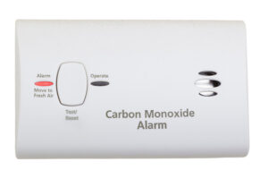 White carbon monoxide detector with "Alarm" and "Operate" lights, Test/Reset button—installed for safety by Vancouver, WA electricians.