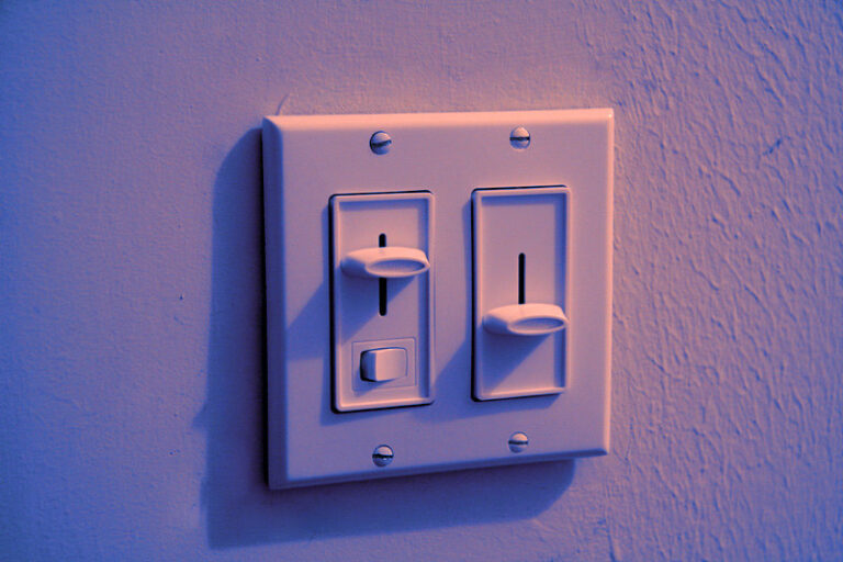 For expert electrician services in Vancouver, WA, consider addressing any buzzing issues with dimmer switches. A white double light switch plate with horizontal sliders can adjust light intensity smoothly but may require troubleshooting to eliminate noise and ensure optimal performance.