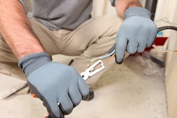 Electrician working on an electrical system in Portland OR