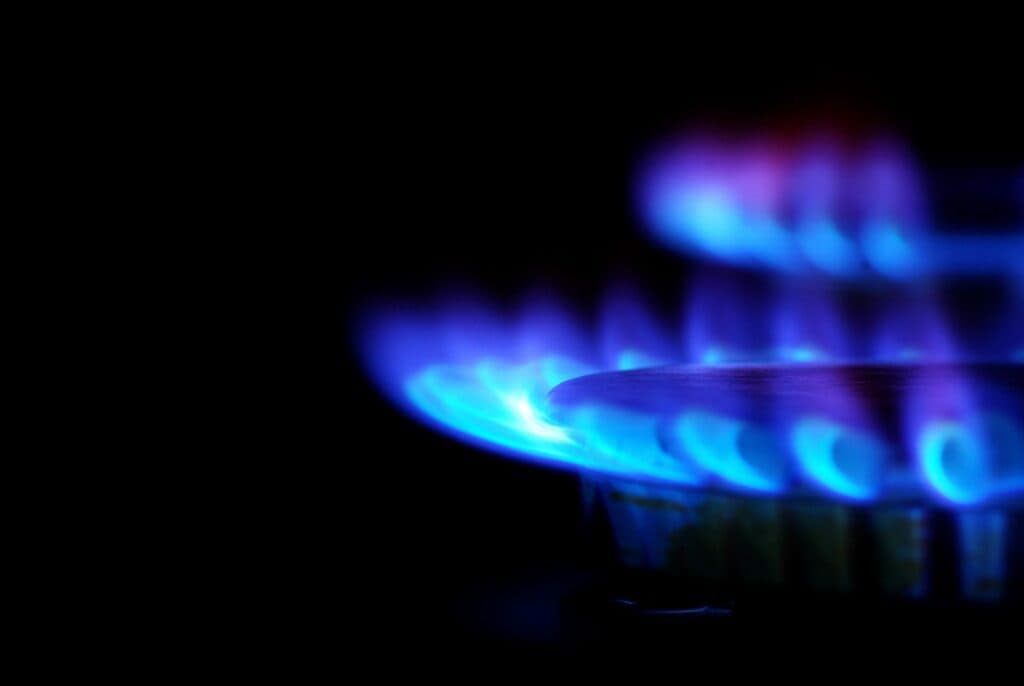 Blue flame from a gas stove burner to illustrate Gas Stoves vs. Electric Stoves A Comparison