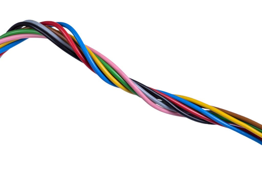 A multi-colored wire against a white background is a common sight for an electrician in Vancouver, WA working on residential or commercial projects. This scenario is just part of the day-to-day job for our expert electricians here in town.