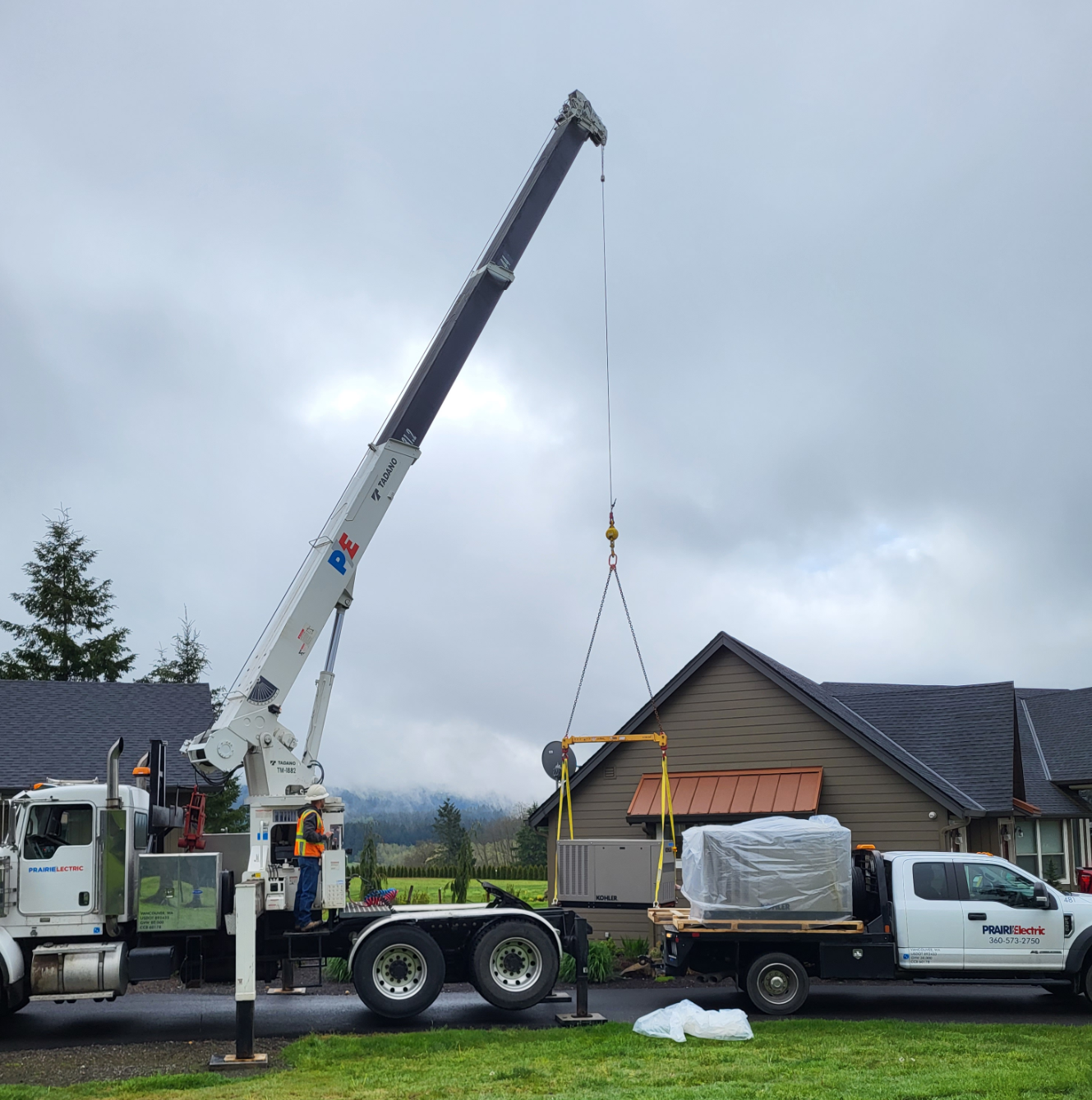 a crane lifts a home generator into place to illustrate How Much Do Home Generators Cost What Factors Affect Price