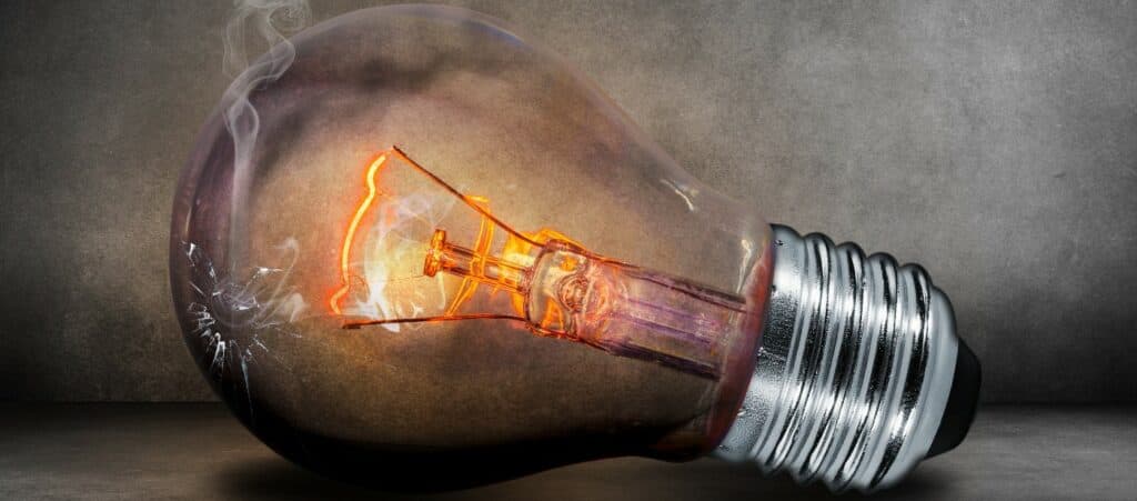 Light bulb with a crack and smoke coming out
