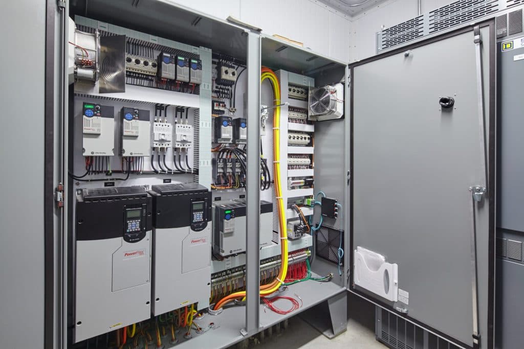 A photo of a programmable logic controller with doors open to illustrate Industrial PLC Programming