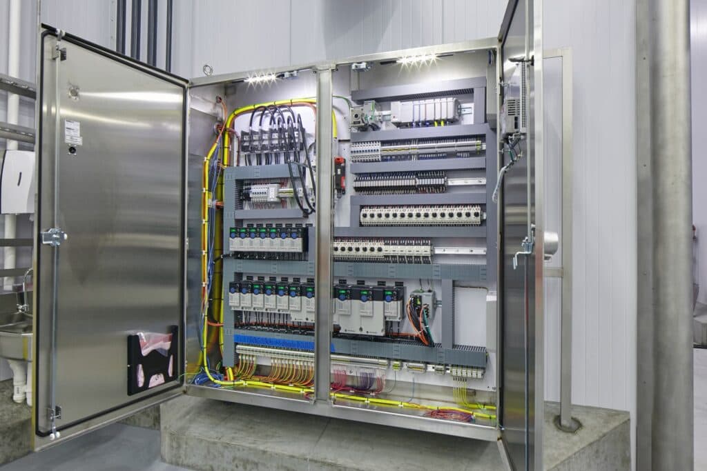 A metal cabinet filled with wires, commonly discovered in residential or commercial electrical systems, is typically handled by our local electricians in Vancouver, WA.