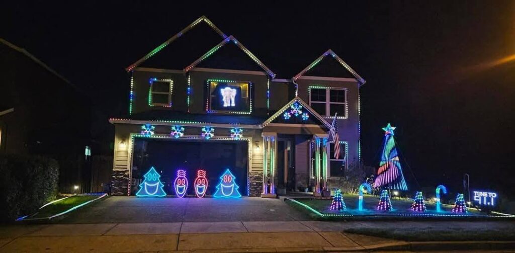 In Vancouver, WA, a two-story home uses pro-installed Christmas lights and displays, powered by expert electrician services.