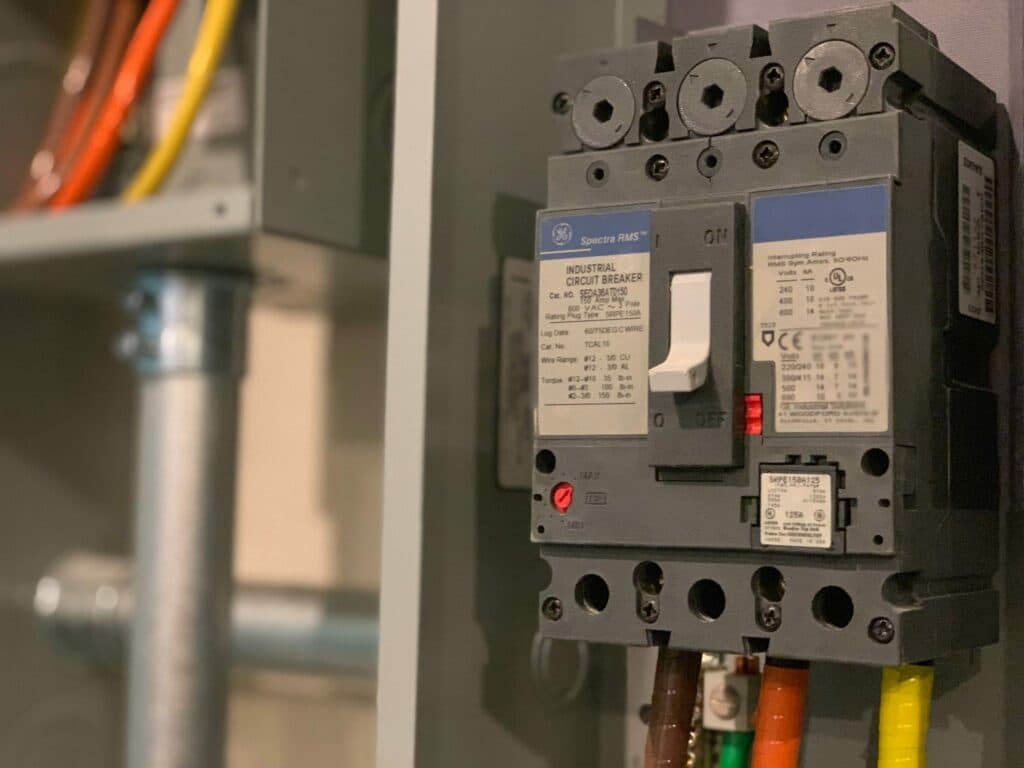 A circuit breaker with wires attached, utilized by our local electricians in Vancouver, WA for electrical service.