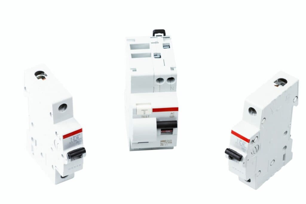 Three distinct types of circuit breakers are displayed on a white background for electricians in Vancouver, WA. These tools are vital components for any local electrician's toolkit.